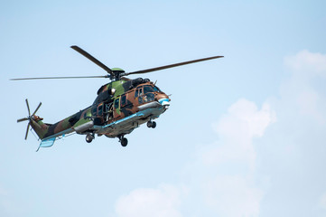 Fototapeta na wymiar Military helicopter in the sky