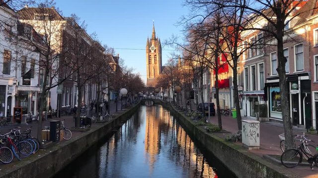 City life in Delft with view of the Old Church and canal