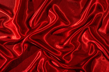 Satin fabric. Shiny red silk backdrop.