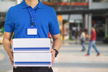 Deliveryman holding cardboard box