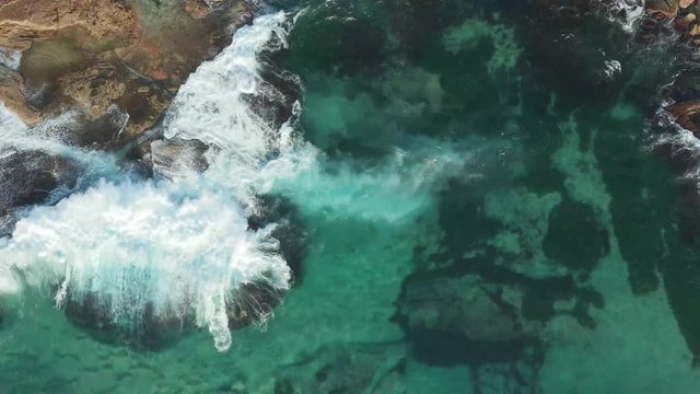 Eastern Suburbs beach Sydney Australia waves breaking over rocks