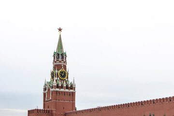 Fototapeta na wymiar Clock tower building peak in Kremlin, Moscow isolated on a white cloudy background