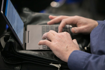 Obraz premium Hands on a laptop keyboard - a journalist, writer or a programmer at work