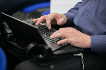 Hands on a laptop keyboard - a journalist, writer or a programmer at work