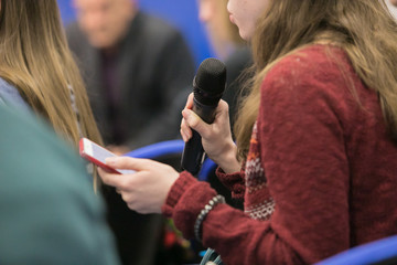 close up of conference meeting microphones and businessman