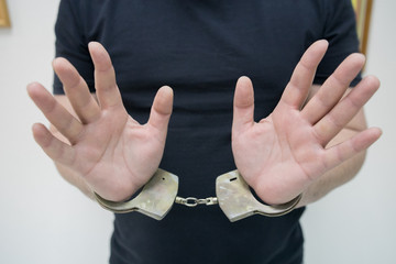  man hands in handcuffs
