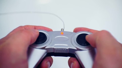 men's hands hold game joystick - Powered by Adobe