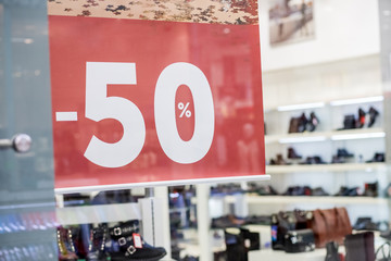 sale 50 off mock up advertise display frame setting over the men shoes shelf in the shopping department store for shopping, business fashion and advertisement concept.Shopping center,shoes fashion