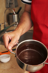 Fototapeta na wymiar The process of cooking milk chocolate cream for traditional 