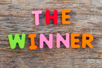 Fototapeta premium The wooden letter came in the word The Winner