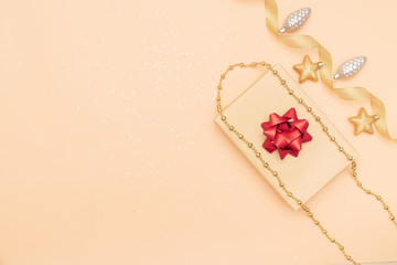 gifts boxes or presents boxes with red bows, star and ball on golden background for birthday, christmas or wedding ceremony