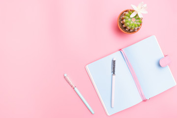 workspace desk styled design office supplies with cactus on pink pastel background minimal style
