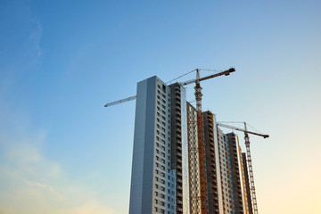 Building and cranes under construction.  High-rise building under construction.  © Yerbolat