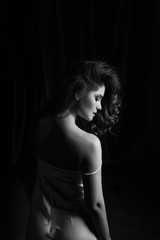 Happy and elegant woman portrait studio shot black and white. Attractive adult brunette sexy girl on black background. Long beautiful healthy hair model girl stock image.