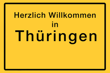 Symbolisches Ortsschild mit Willkommensgruß für ein deutsches Bundesland