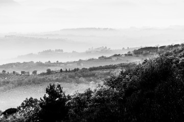 Fototapeta premium Fog filling a valley in Umbria (Italy), with layers of mountains and hills