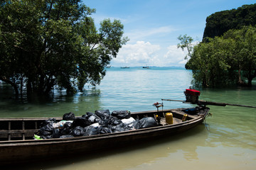 Fototapeta premium Urban sanitary vehicle garbage loader Ship boat. Residential and commercial solid waste collection and transportation help preserve environment and carry to drop at Land shore