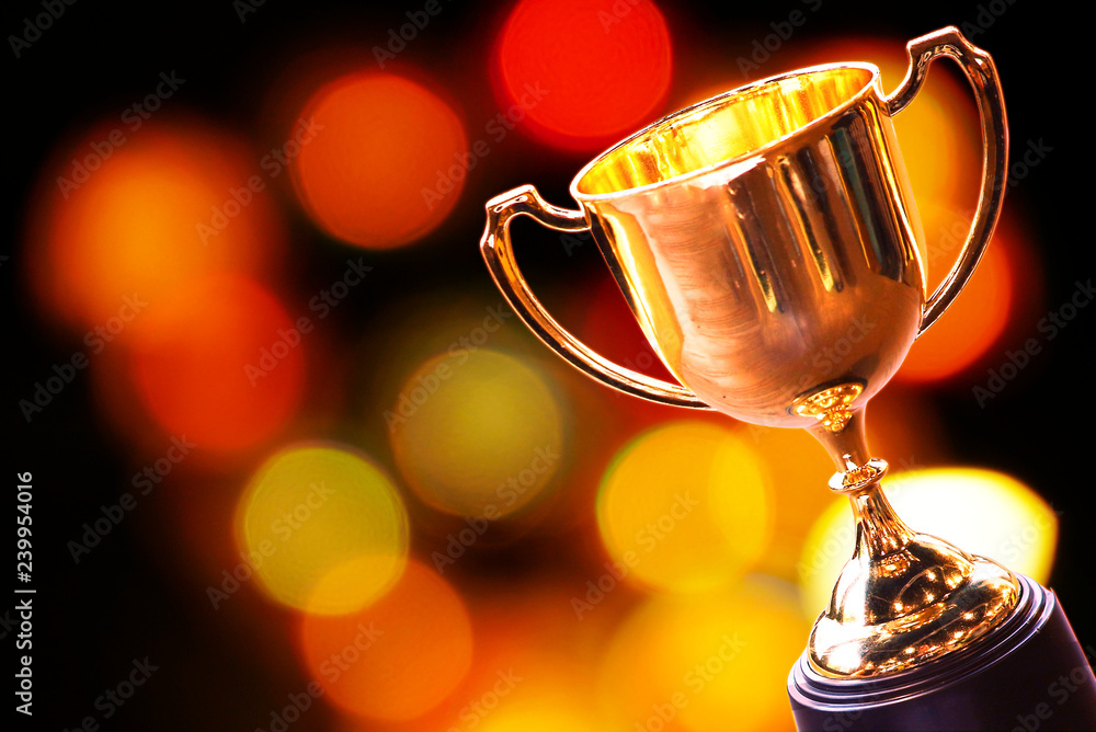 Wall mural trophy with abstract bokeh light background