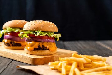 fresh tasty beef burger with cheese and french fries