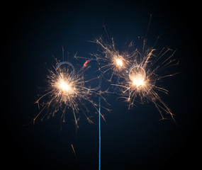 Sparkler isolated on black, 2019