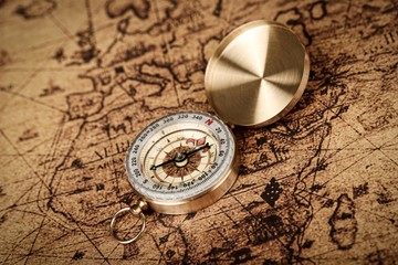 compass on old world map  - Vintage Explorer  concept