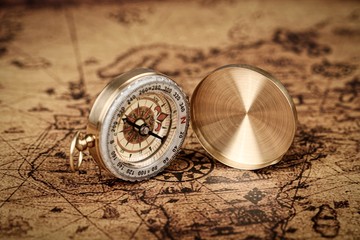 compass on old world map  - Vintage Explorer  concept