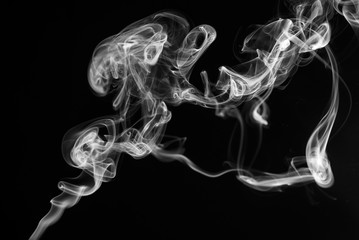 Cigarette smoke close up on a black background, abstract background