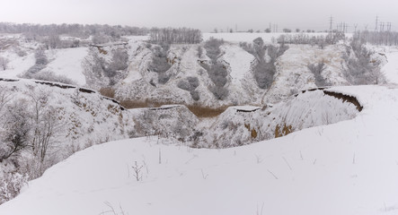 January landscape with soil erosion in suburbs of Dnipro city, Ukraine