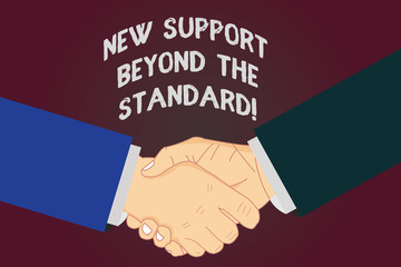 Writing note showing New Support Beyond The Standard. Business photo showcasing Excellent assistance useful service Hu analysis Shaking Hands on Agreement Sign of Respect and Honor