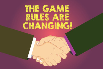 Word writing text The Game Rules Are Changing. Business concept for Changes in established competition agreements Hu analysis Shaking Hands on Agreement Greeting Gesture Sign of Respect photo