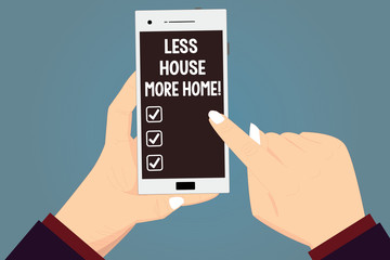 Word writing text Less House More Home. Business concept for Have a warm comfortable place to live with family love Hu analysis Hands Holding Pointing Touching Smartphone Blank Color Screen