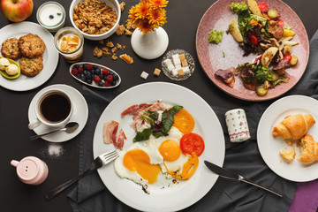 Restaurant breakfast with bacon and fried eggs