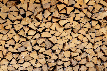 wall firewood, Background of dry chopped firewood logs in a pile