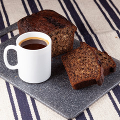 Homemade banana bread with a cup of coffee for breakfast