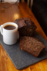 Homemade banana bread with a cup of coffee for breakfast
