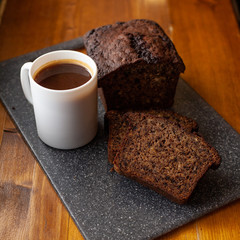 Homemade banana bread with a cup of coffee for breakfast