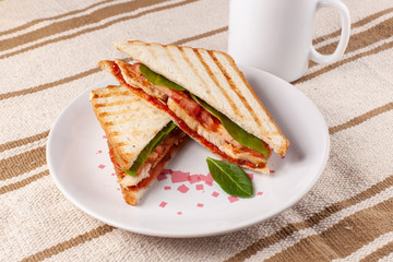 Toast with chicken, tomato, herbs and breakfast sauce