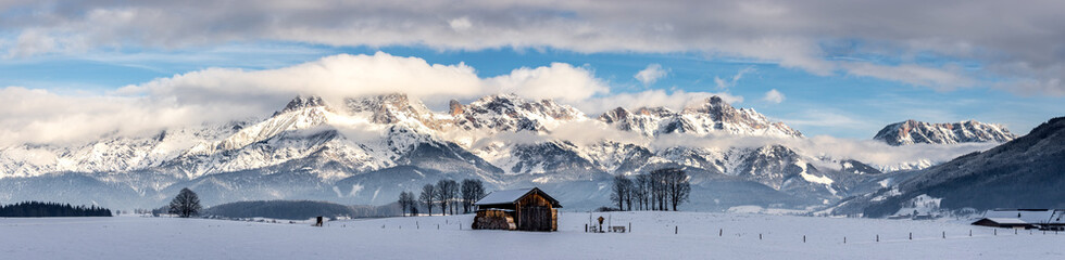 Snowy mountains, meadow and a hut, landscape in Austria, panorama