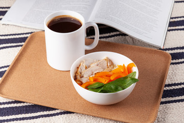 Healthy breakfast with couscous, chicken, pepper, spinach leaves and a cup of coffee
