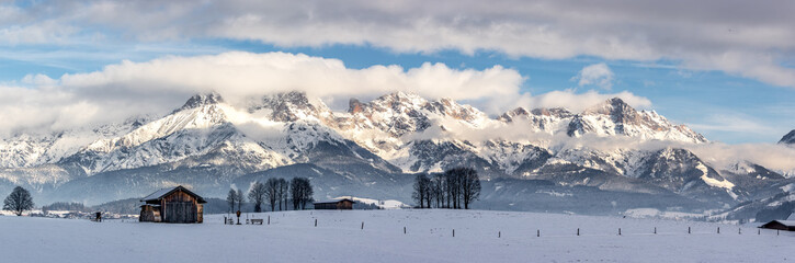 Snowy mountains, meadow and a hut, landscape in Austria, panorama