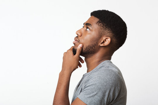 Thoughtful African-american Man Profile Portrait On White