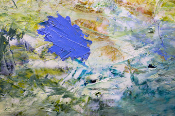 multi-colored strokes of oil paint on the artist's palette. background