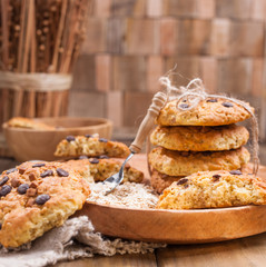 Biscuit biscuits with chocolate drops. Healthy homemade pastries. Photo in rustic style, food on wooden background. Free space for text.