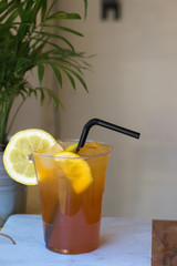 iced lemon tea in plastic cup