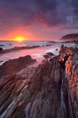 Sunset over the ocean in Garden Route NP, South Africa