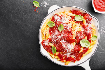 Tomato italian penne pasta served in pan