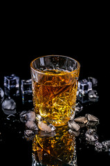 Whiskey with ice in rocks glass isolated on black background with clipping path. copy space. concept luxury drink