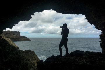 Photographer in animal flower cave barbados - obrazy, fototapety, plakaty