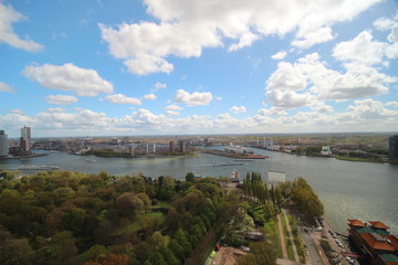 Overview over the city of Rotterdam in the Netherlands with its harbors and bridges over the river Oude Maas.