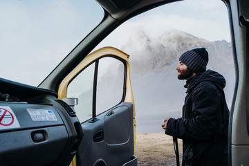Man with photo camera on remote road
